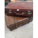 Vintage travel trunk with wooden bounding together with leather travel case.