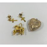 9kt gold heart , horse pendants and cross earrings. 3.65gr