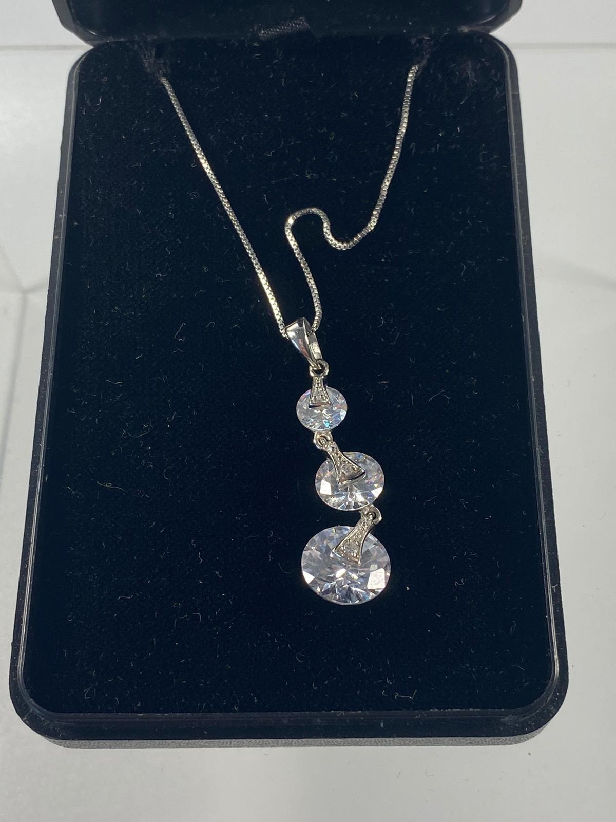 Silver necklace set in swarovski crystal pendant.