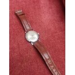 British made timex watch with brown leather strap.