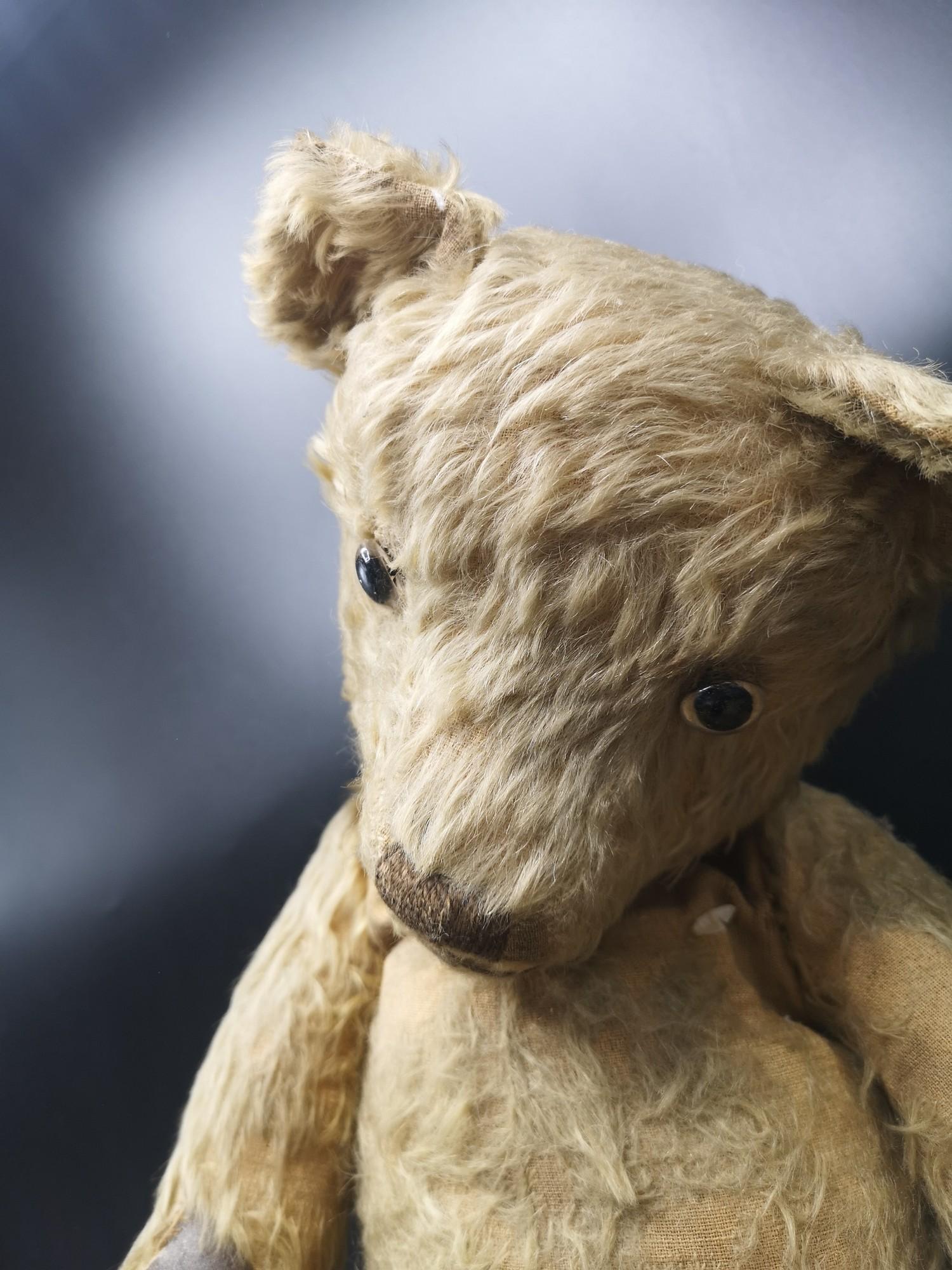 Antique Teddy with jointed limbs and hump back and glass eyes. - Image 2 of 3