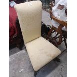 Victorian chair with yellow upholstery.