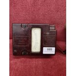 Vintage bakelite volt testing machine with winding handle and leather case. .