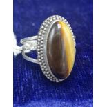 White metal tiger eye ring marked 950.