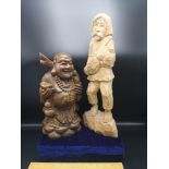Large carved eastern figure together with large carved Buddha figure.