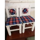 Pair of tartan upholstered child's chairs.