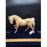 Large Beswick light brown horse figure with cream main and tail.