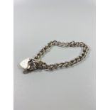 Silver Hall marked chain bracelet with lock attachment. 19.78gr 20cms diameter