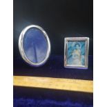 2 silver Hall marked photo frames.