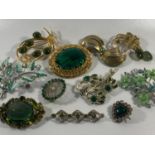 Collection of 11 brooches to include vintage green brooch.
