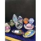 Collection of paper weights in cludes swass.