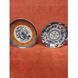 2 Oriental plates one signed to base.