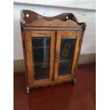 Antique 2 door smokers cabinet.