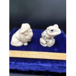 2 carved animal figure.