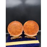 Pair of cinnerbar Chinese plates depicting ghiesha scenes with 4 character signature to base with