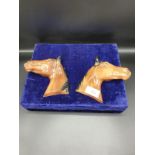 Pair of ceramic horse head plaques.