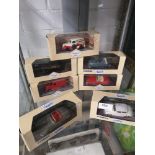 Shelf of corgi car models.
