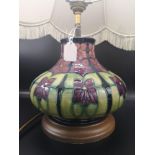 Moorcroft Violets patterned table lamp.