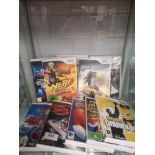 Shelf of Nintendo wii games.