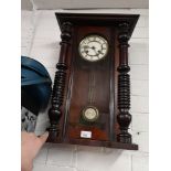 Antique wall clock with pendulum.