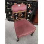 Edwardian parlour chair with pink upholstery.