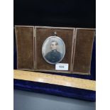 Silver Hall marked picture frame with military gentleman miniature painting with original case.