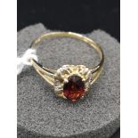 9ct gold diamond and garnet set ring. Size o.