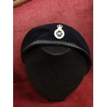 Military berret hat with Corp badge.