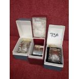 3 Silver Hall marked napkin rings boxed.