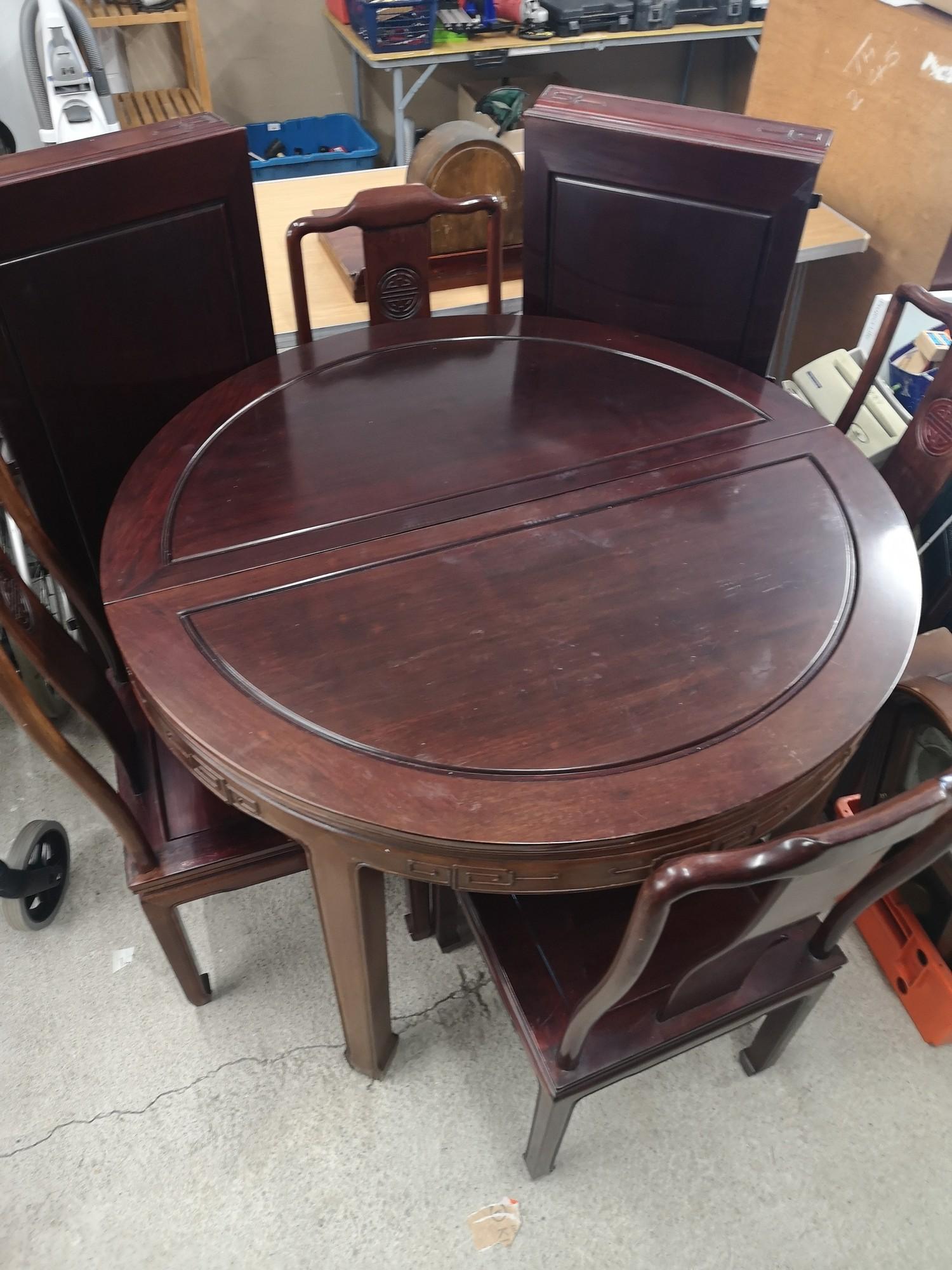 Chinese table with 4 chairs and two extending leafs.