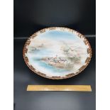 Antique japenese porcelain large skalloppet side plate with character signatures to base.
