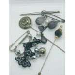 Lot of scottish kilt pins.