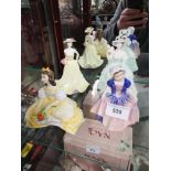 Lot of royal doulton and other figures.