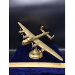Heavy brass world war two bomber plane 9 inches In length by 12 inches in width.