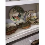 Shelf of Royal doulton dickins ware Robin Hood items..