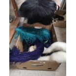 Fur muff and collection of fur and feather items .