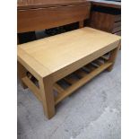 Light wood coffee table.