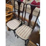 Pair of victorian chairs with silk upholstery.