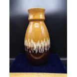 West German pottery vase stands 11.5 inches in height.