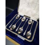Set of six silver teaspoons with religious figural mounts.