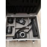 Cannon camera with accessories in fitted case.