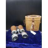Set of stunning binoculars with leather fittings with stunning leather casing.