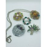 Multi stone pendant/brooch together with 4 stunning vintage scottish brooches.