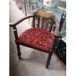 Antique oak captains arm chair with bobble supports.