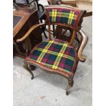 Antique tartan upholstered arm chair.