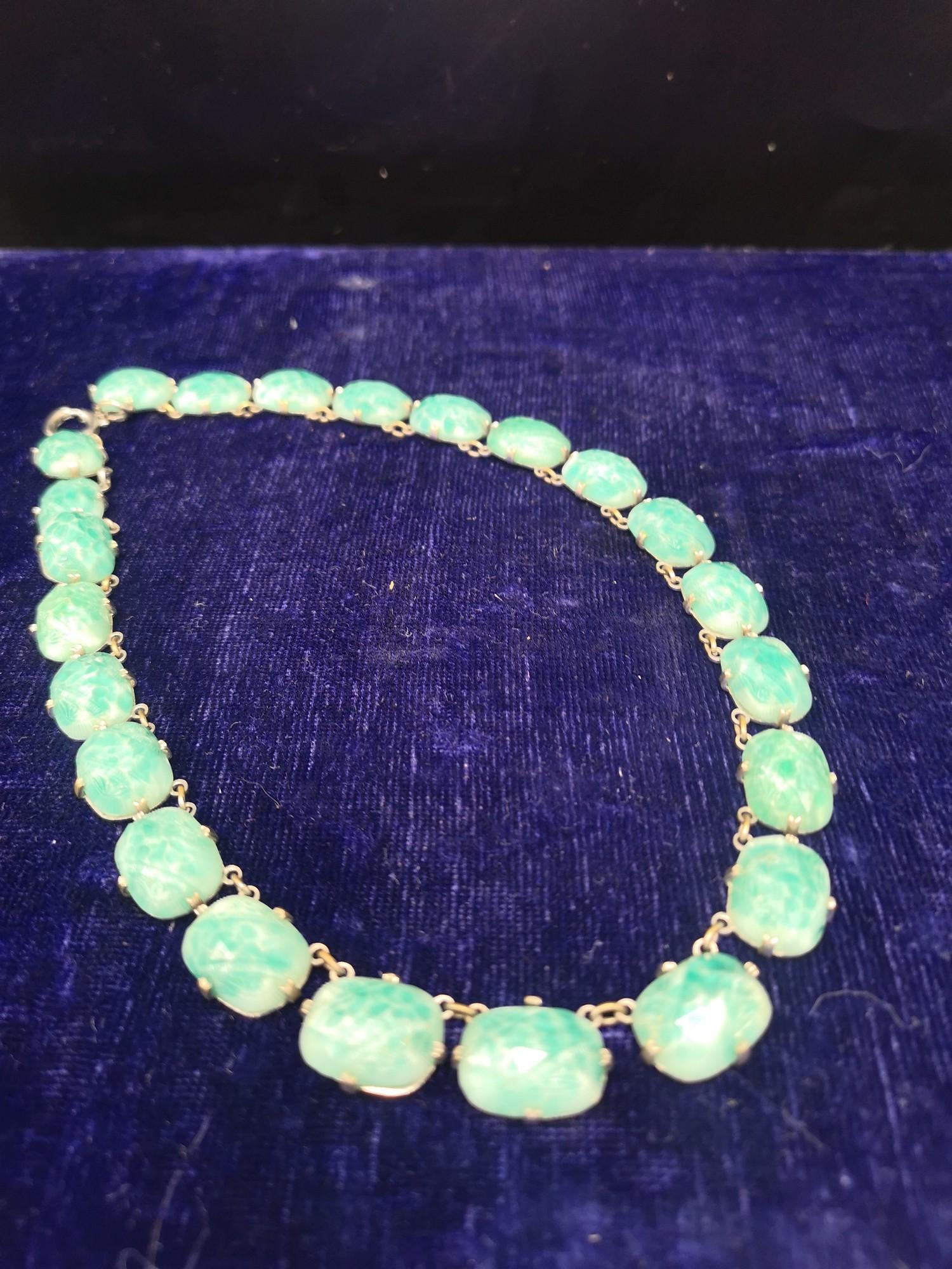 Jade / white metal necklace.