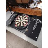 Winmau dart board with fitted cabinet.