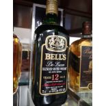 Bottle of bells 12 year old deluxe bottled and blended by Arthur Bell & Sons plc 75cl 40% full and