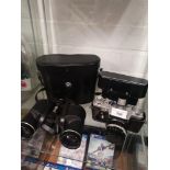 Zenit e camera together with set of binocalurs with case.