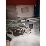 Boxed AL-100 entertainment projector.